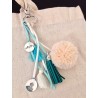 5 pompons en suédine